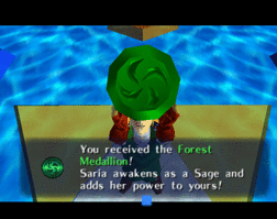 Link holding the Forest Medallion.